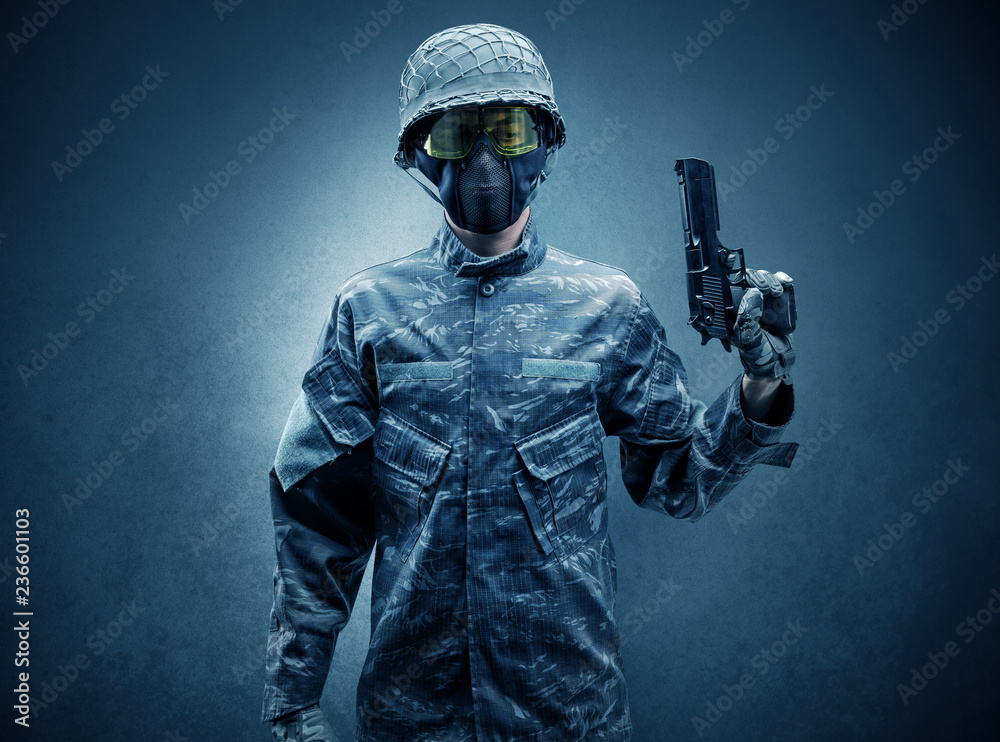 Soldier agent in a dark room with arms on his hand and gas mask Stock ...