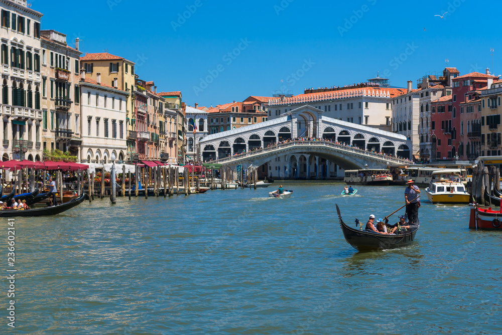 The Grand Canal, gondola and Rialto bridge in Venice, Italy