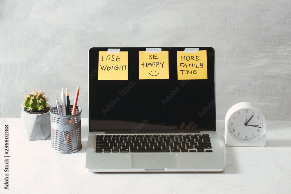 colored paper stickers with business strategy and laptop on tabletop