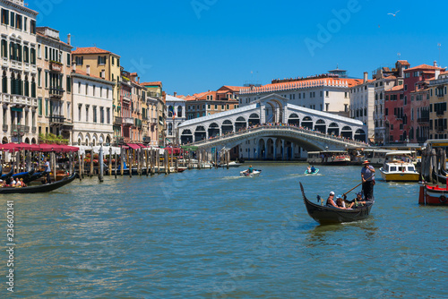 The Grand Canal, gondola and Rialto bridge in Venice, Italy © PopsaArts