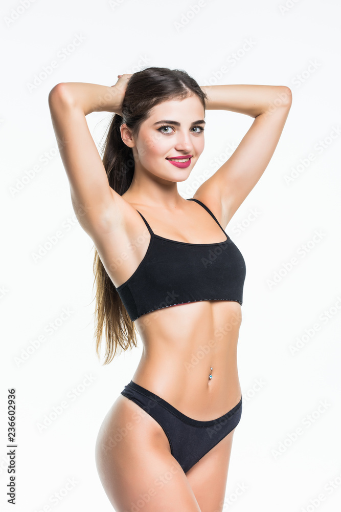 Sexy attractive brunette woman posing in fashionable lingerie in studio isolated on white Sexy attractive brunette woman posing in fashionable lingerie in studio isolated on white