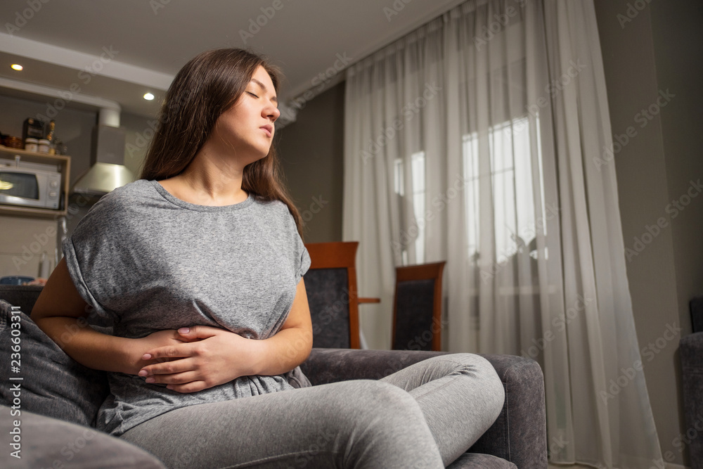 young woman has pain in right hypochondrium, young woman has a stomachache, gallbladder disease young woman has pain in right hypochondrium, young woman has a stomachache, gallbladder disease