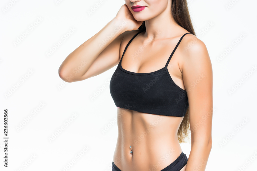 Fototapeta premium Slim tanned woman's body isolated over white background. Healthy lifestyles concept.