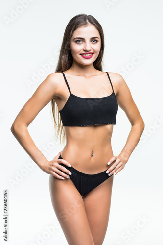 Beautiful woman with perfect figure in black underwear isolated on white background