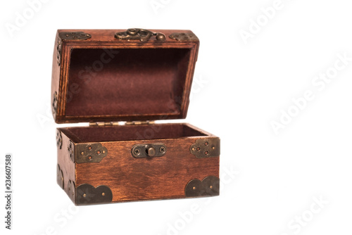 Beautiful wooden opened box with an iron forged lock on a white background. Isolated