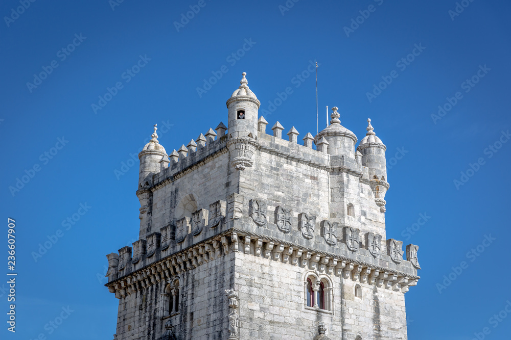 Belem, Portugal - May 5th 2018 - A tourist looking through the window of the Belem Tower in blue sky day in Belem, Portugal