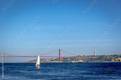 A boat sailing in the Tejo river in Lisbon in Portugal