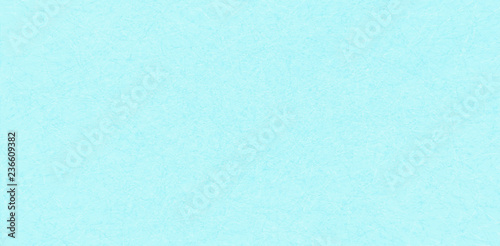 Marble pattern of tangled threads on light blue background, blank sheet of paper or plywood.