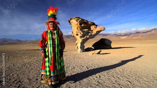 Portrait of Latin American Indigenous women in traditional National Headdress and costume viewing The Stone Tree South America photo