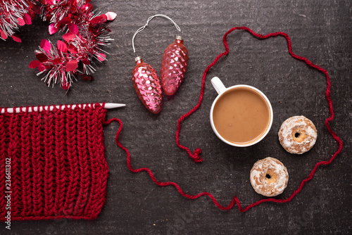 Christmas composition with knitting, coffee and decoration