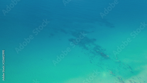 Aerial drone top view of transparent sea ocean water surface