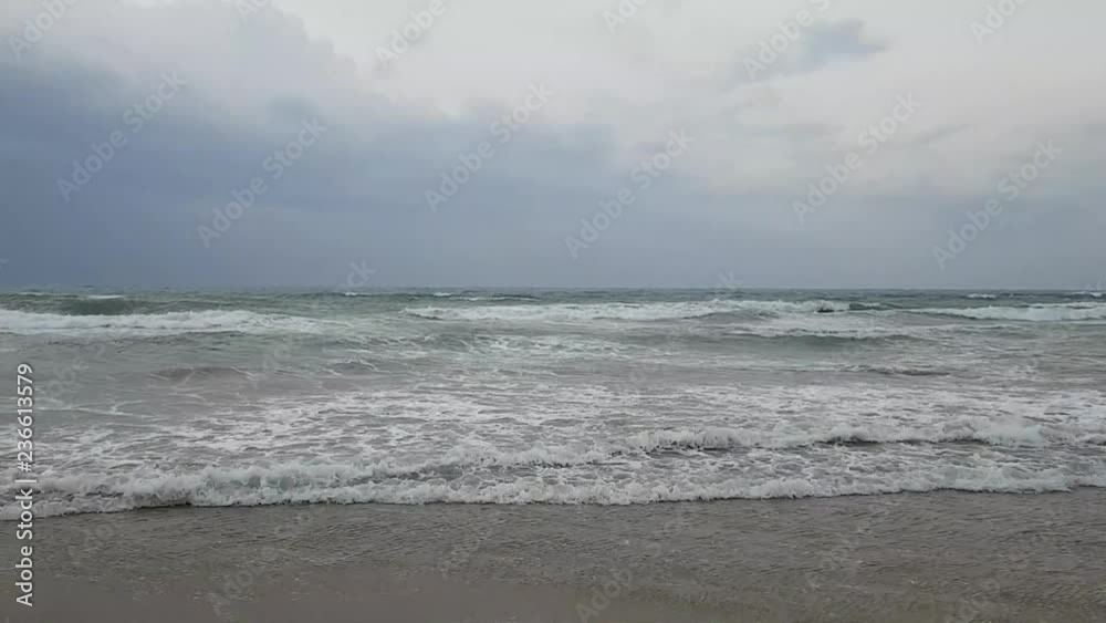 Mediterranean sea from Turkey in cloudy weather. Romantic sunset and big waves in windy weather Mediterranean sea from Turkey in cloudy weather. Romantic sunset and big waves in windy weather