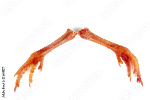 Pair of cured chicken feets isolated on white background