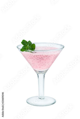 Glass of homemade strawberry yogurt with cia seeds and mint