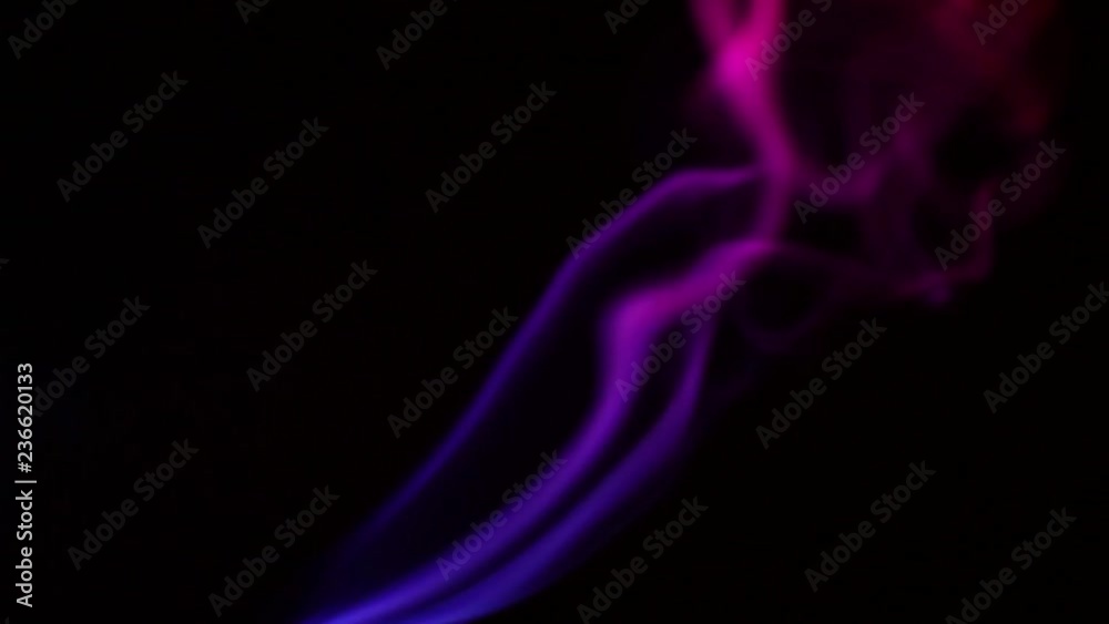 Multicolored smoke from aromatic sticks close up on black background Multicolored smoke from aromatic sticks close up on black background