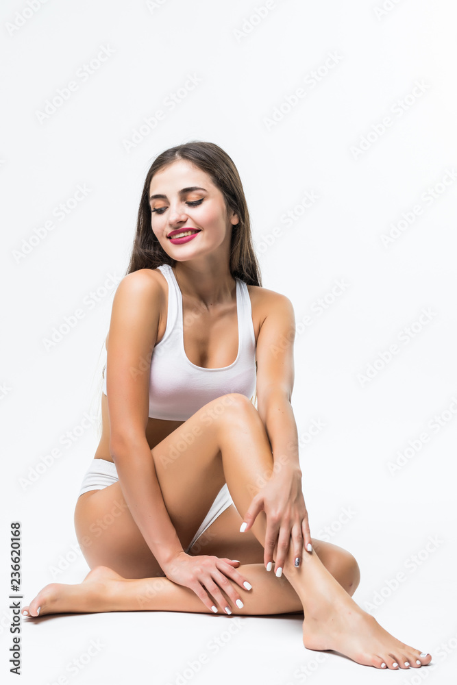 Young woman in white underwear sitting on floor Young woman in white underwear sitting on floor