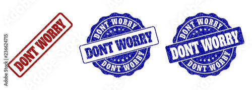 DONT WORRY scratched stamp seals in red and blue colors. Vector DONT WORRY labels with grainy effect. Graphic elements are rounded rectangles, rosettes, circles and text labels.