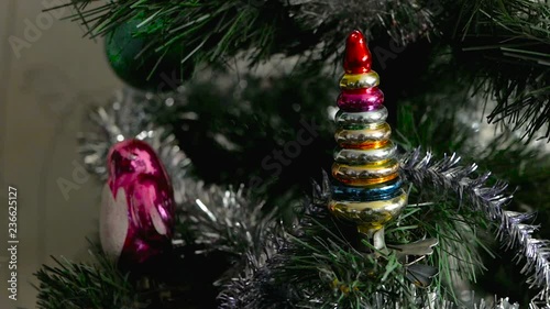 Christmas glass toy on the Christmas tree. Little tree photo