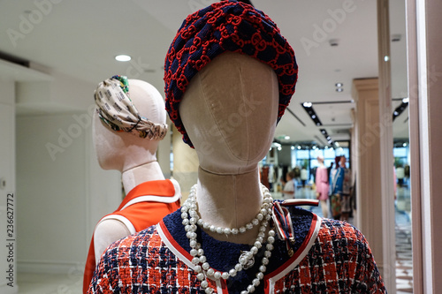 Mannequin's head in black and red turban and pearls neckless