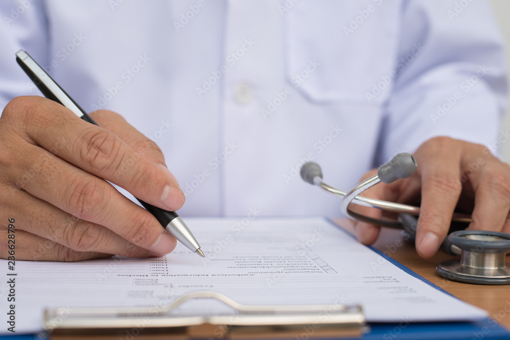 Doctor writing health checklist Doctor writing health checklist