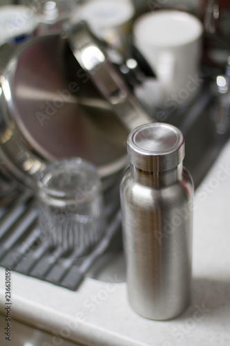 Insulated Stainless Bottle with utensils on sink kitchen