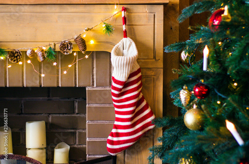 Christmas decorations stocking and toys hanging over the fireplace