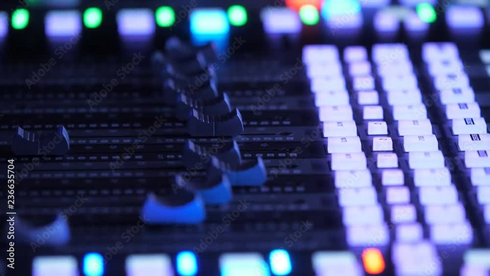 Sound engineer plays music on mixer at the concert Sound engineer plays music on mixer at the concert