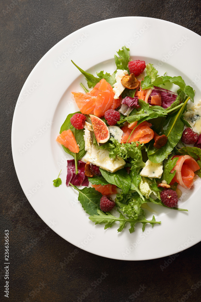 Fresh salad with salmon above