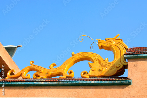 Yellow dragon sculpture in a park, China © zhang yongxin