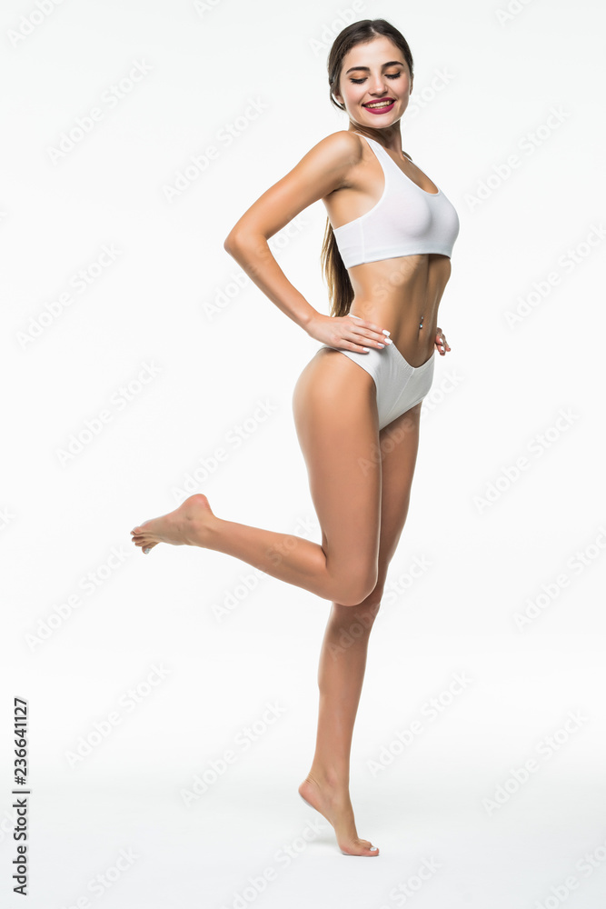 Full length portrait of smiling young woman in lingerie isolated on white. Healthcare. Full length portrait of smiling young woman in lingerie isolated on white. Healthcare.