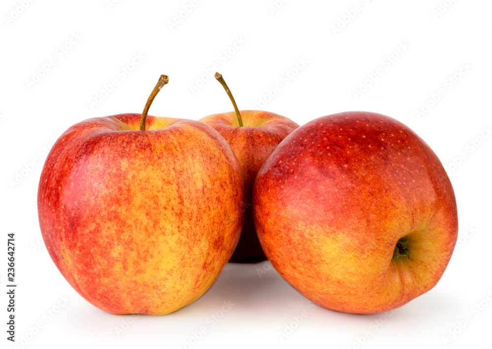 Three ripe red apples close up on a white. Isolated.