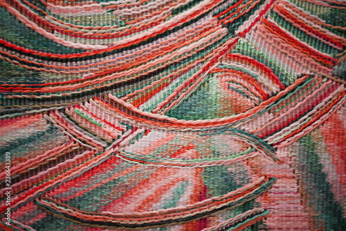 NABEREZHNYE CHELNY - 13  NOVEMBER  2016: Exhibition Odintsov Elena Innokentevna. Colored tapestry with multicolored decorative pattern. Woven home rugs - traditions craft and decor of interior.
