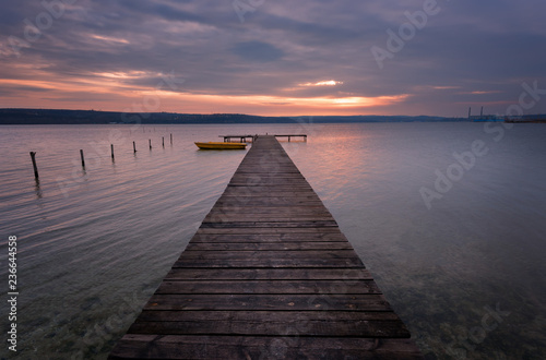 Seascape during sunset. Beautiful natural seascape, blue hour. Sea sunset at a lake coast near Varna, Bulgaria. Magnificent sunset with clouds in the middle of February. © djevelekova