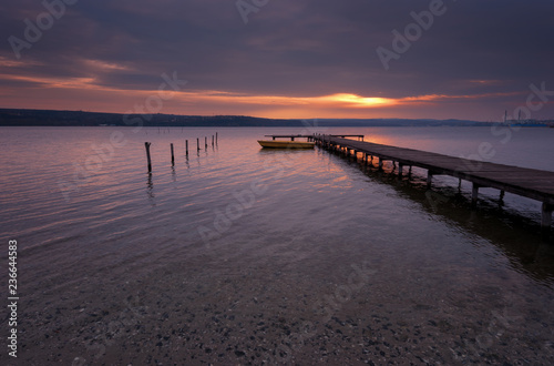 Seascape during sunset. Beautiful natural seascape  blue hour. Sea sunset at a lake coast near Varna  Bulgaria. Magnificent sunset with clouds in the middle of February.