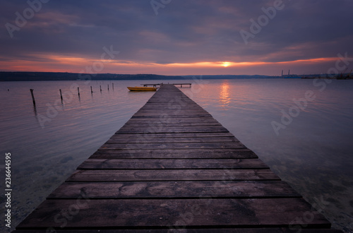 Fototapeta Naklejka Na Ścianę i Meble -  Seascape during sunset. Beautiful natural seascape, blue hour. Sea sunset at a lake coast near Varna, Bulgaria. Magnificent sunset with clouds in the middle of February.