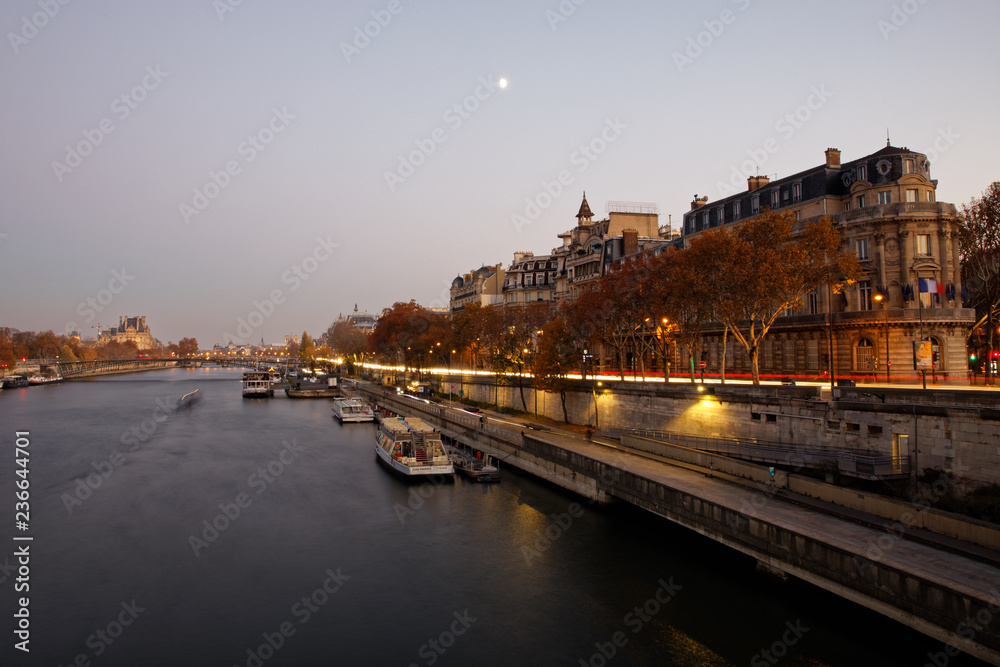 Paris, France - November 17, 2018: Haussmann buildings and river Seine at sunset in Paris