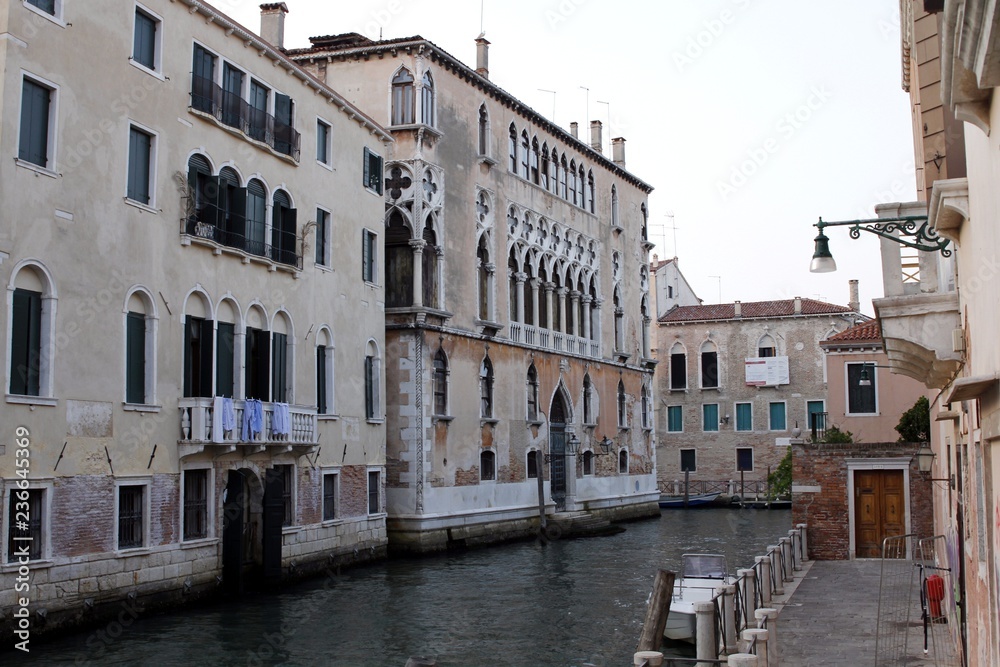 Canal street with balcony in Venice, Italy