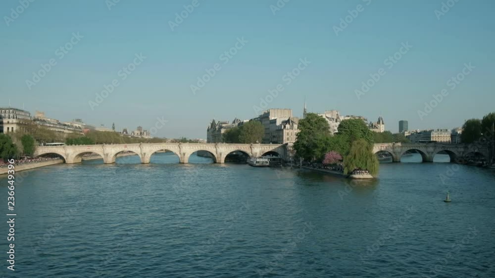 Wide angle camera still view Pont Neuf at the tip of Ile de la Cite seen from Pont des Arts over the River Seine in Paris, France