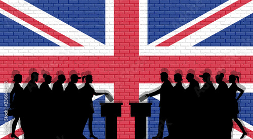 British voters crowd silhouette in election with United Kingdom flag graffiti in front of brick wall