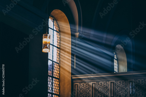 Light rays through the black window. Toned photo
