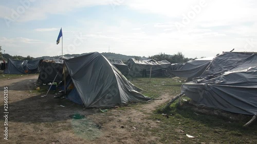 Refugees and migrants camp Trnovi near Velika Kladusa, Bosnia and Herzegovina near Croatian and EU border. Syrian refugees trying to enter EU. Tents in camp. The European migrant crisis. Balkan Route. photo