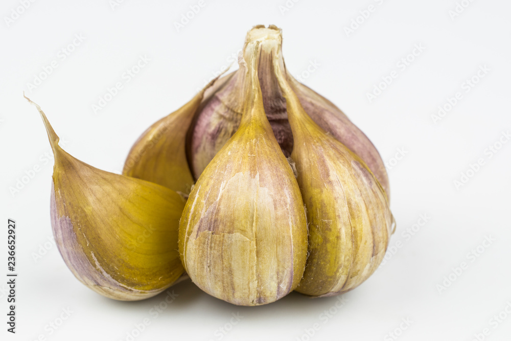 Fototapeta premium A garlic with slices isolated on a white background.