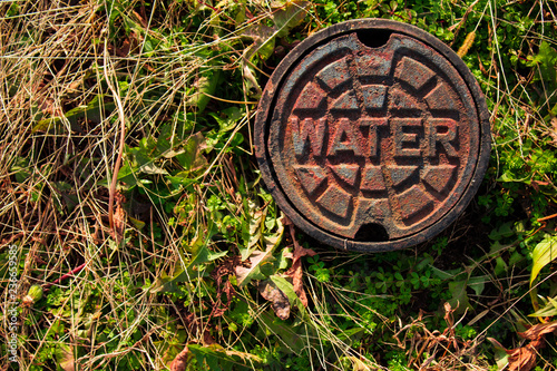 Water Main Cover on the Side of the Road