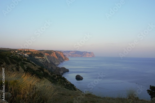 sunset on coast of sea
