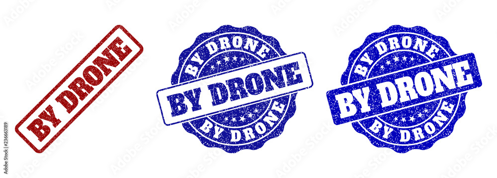 Obraz premium BY DRONE grunge stamp seals in red and blue colors. Vector BY DRONE overlays with grunge surface. Graphic elements are rounded rectangles, rosettes, circles and text captions.