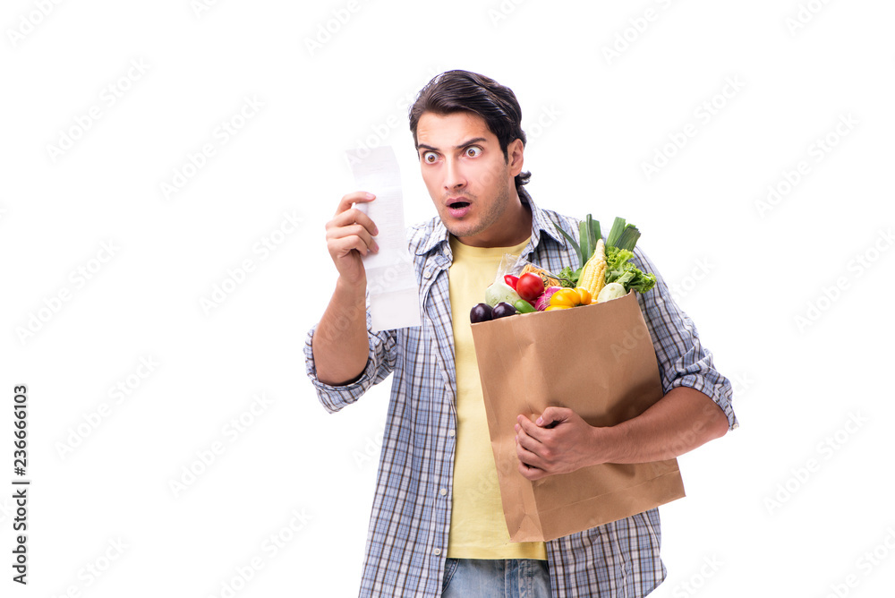 Young man with his grocery shopping on white Young man with his grocery shopping on white