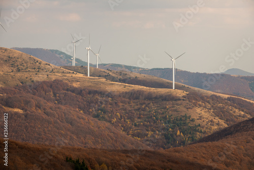 Wind turbines in the mountain, at a sunny autumn day
