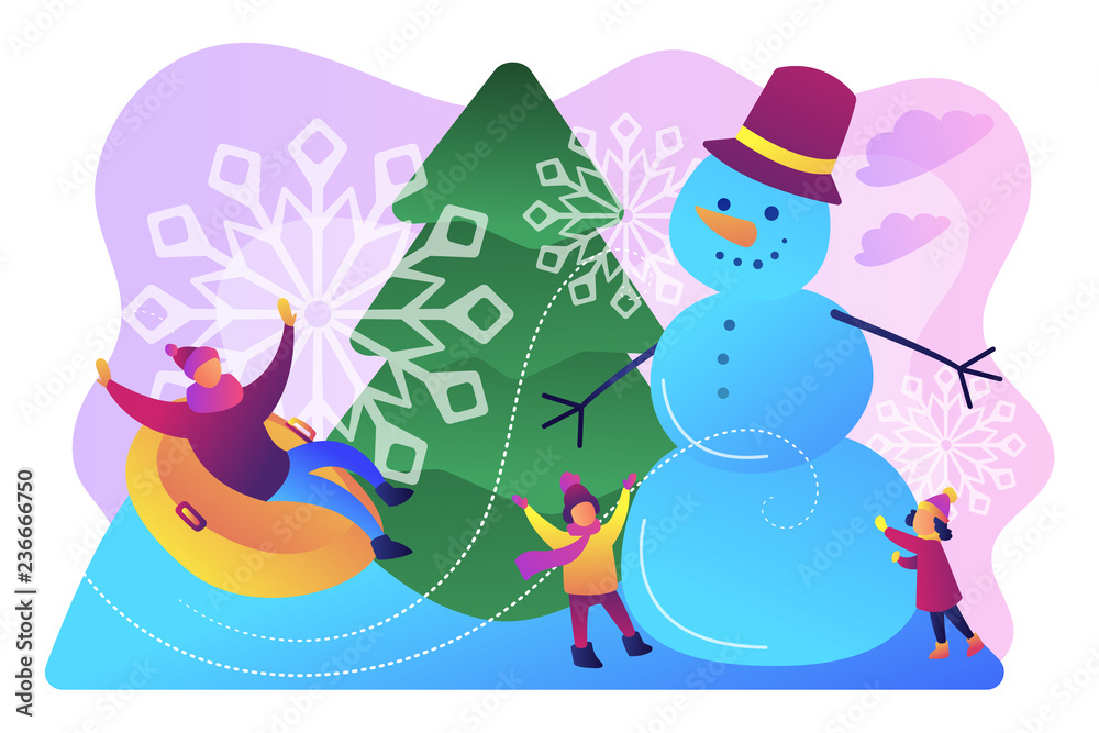 Happy people having fun outdoor in winter sledding and making snowman Happy people having fun outdoor in winter sledding and making snowman