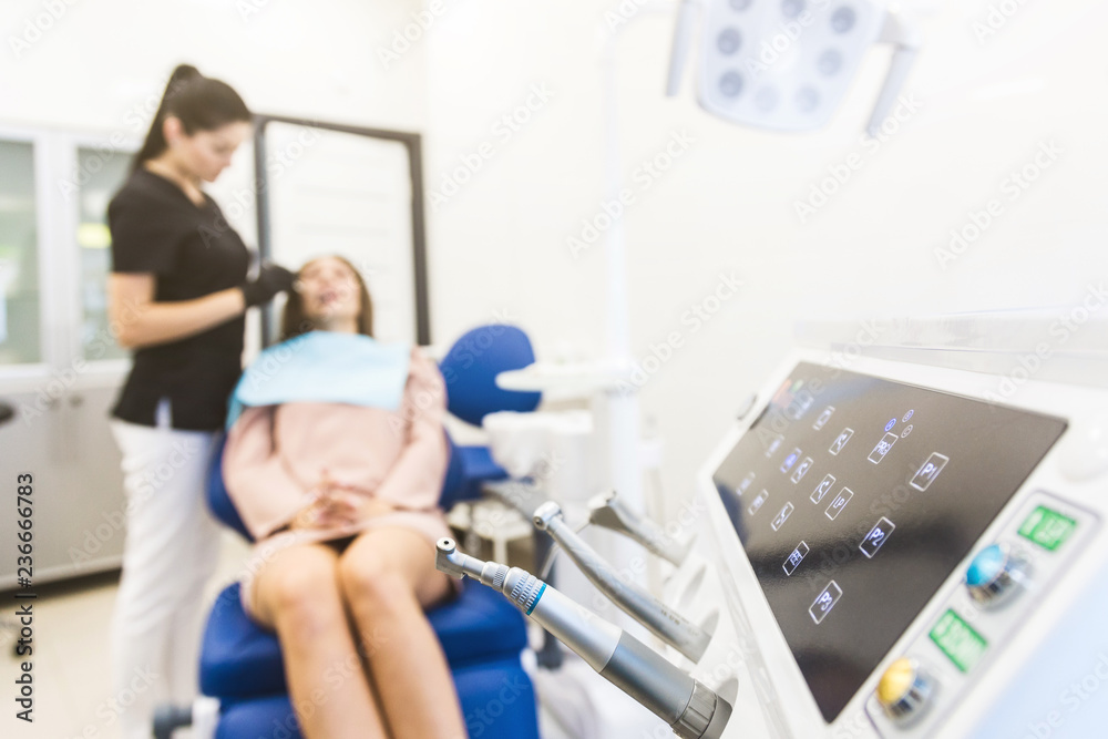 Fototapeta premium Dental clinic. Reception, examination of the patient. Teeth care. Modern dental equipment.