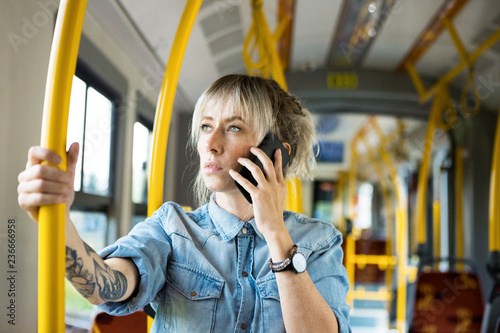 Young woman in city transport